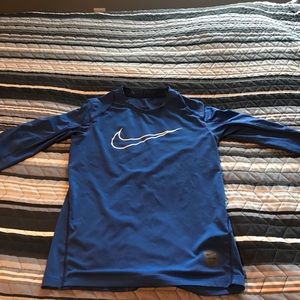 Blue long sleeve Nike shirt.